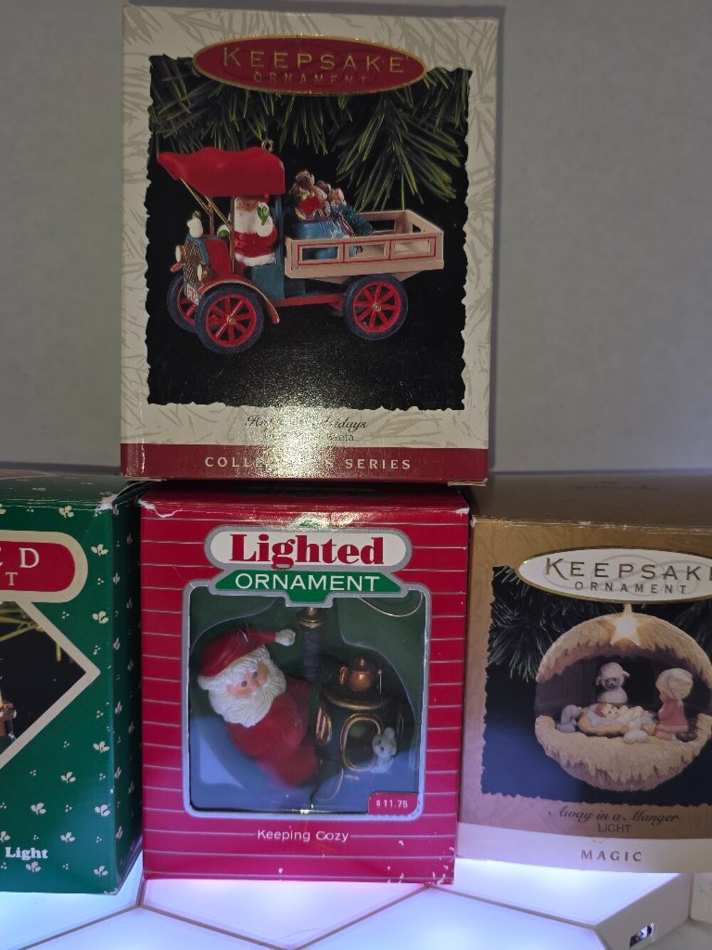 Hallmark Keepsake Lighted Christmas Ornaments packaged in their original boxes.